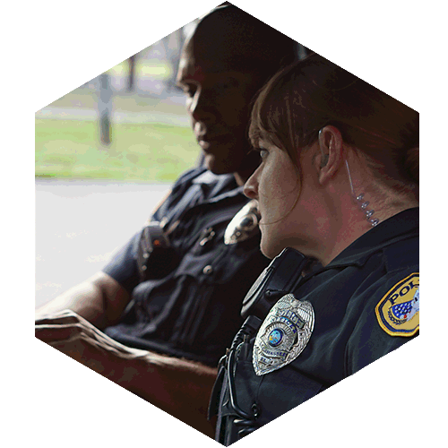 Two Police Officers sitting in a police car.