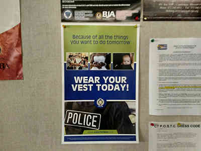 Wear your vest today poster on bulletin board