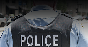 Man checking vest in locker room.