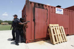 Two officers taking cover. 